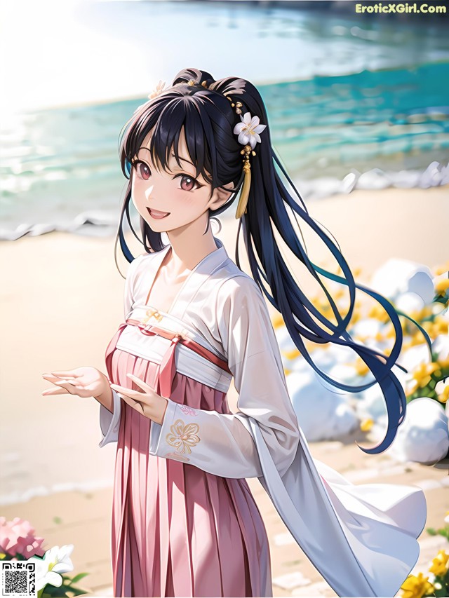 A woman in a pink dress standing on a beach.